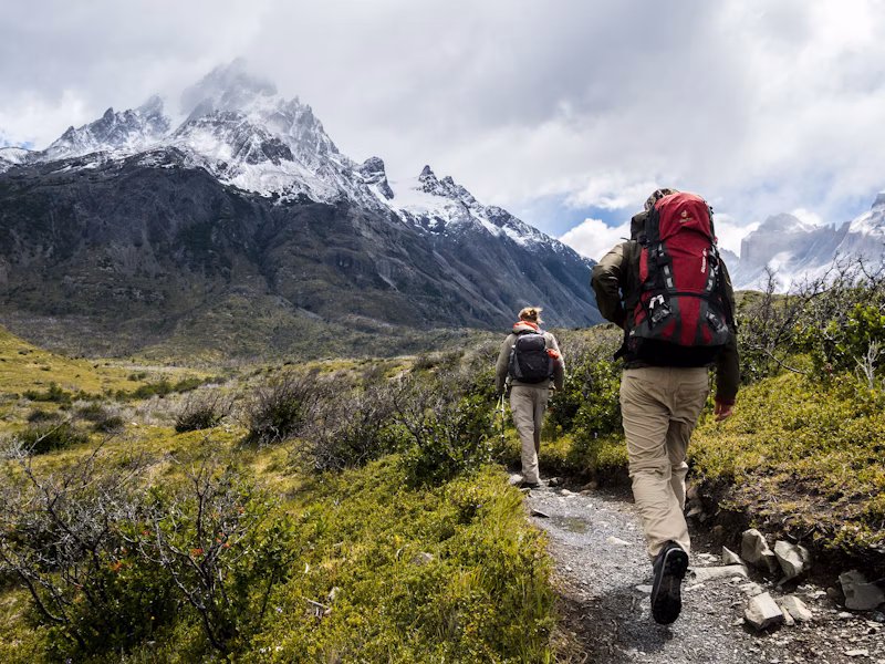 Two people hiking up a mountain